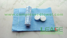 Compressed nonwoven towel